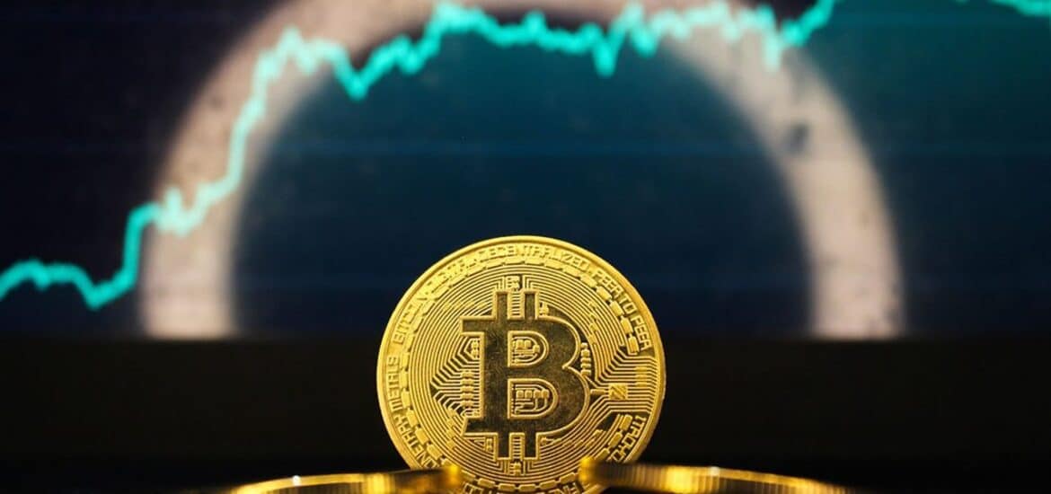 bitcoin,stands,in,front,of,a,green,rising,price,chart,
